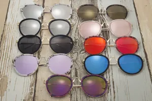 Variety of round frame fashion sunglasses with colorful mirrored lenses and metal bridge