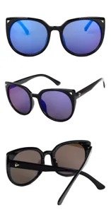 Detail view of black cat-eye sunglasses with blue mirrored lenses and triangle accents.