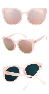 Detailed views of oversized cat-eye sunglasses in light pink with pink mirrored lenses