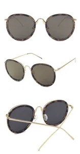 Detailed views of round tortoise shell sunglasses with slim gold metal temples