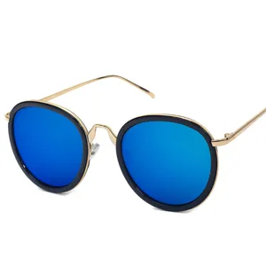 Fashionable round oversized sunglasses with blue mirrored lenses and gold metal frames