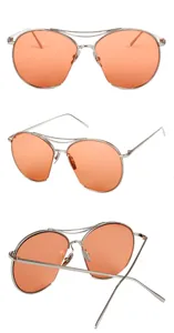 Detaillierte Mehrwinkelansicht einer stylischen silbernen Sonnenbrille mit orangefarbenen Gläsern