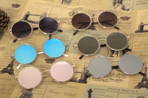 Collection of cat ear round sunglasses in various lens colors with gold metal frames