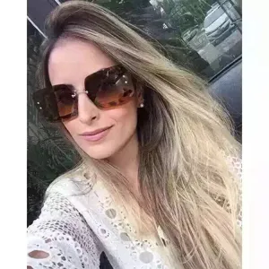 Fashion oversized square frame sunglasses with stylish tortoiseshell pattern on a model