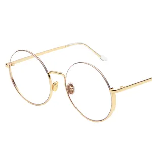 Occhiali alla moda con montatura tonda in metallo dorato e lenti trasparenti per unisex