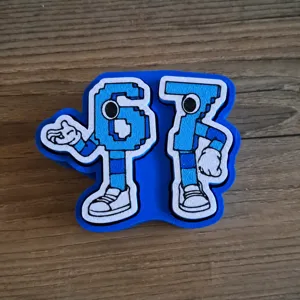 Detail view of the 67 number decompression fidget toy, blue and white plastic design.