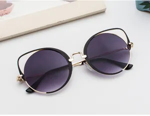 Vintage cat-ear round sunglasses for women with elegant purple gradient lenses and gold frame
