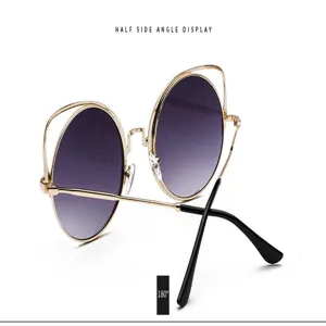 Cat-eye round sunglasses with gold metal frame and purple gradient lenses detail