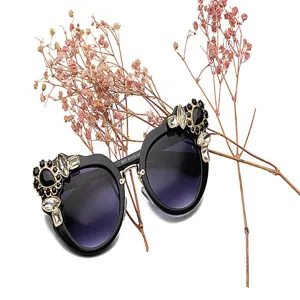 Close-up of fashion oversized sunglasses for women with luxury flower rhinestone decor