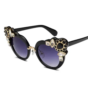 Oversized floral rhinestone sunglasses for women with elegant black cat-eye frames.