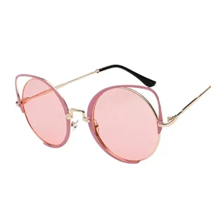 Trendy retro round pink sunglasses with unique gold cat ear frame design for women