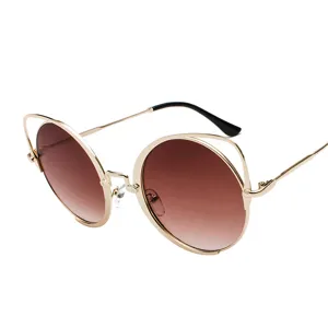 Trendy women's sunglasses with retro cat-ear design and round brown gradient lenses