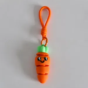 Close-up of a 3D printed carrot keychain, cute movable vegetable toy pendant for bags and keys.