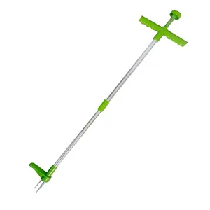 Detail view of the weed puller tool, featuring metal tines and ergonomic green handle.