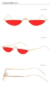 Vue détaillée de lunettes de soleil demi-cerclées œil-de-chat rouges avec monture dorée