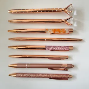 Set of 8 rose gold ballpoint pens with crystal diamonds, glitter, and liquid floral designs.