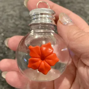 Handheld hummingbird feeder clear bulb design with orange flower feeding port outdoor yard decor