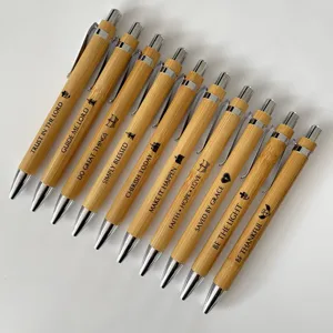 Set of 10 bamboo ballpoint pens featuring engraved Bible verses and inspirational quotes.