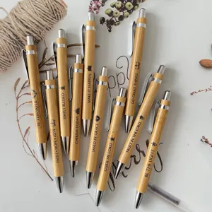 Detailed view of the 10-piece bamboo ballpoint pen set with inspirational Bible verse engravings.