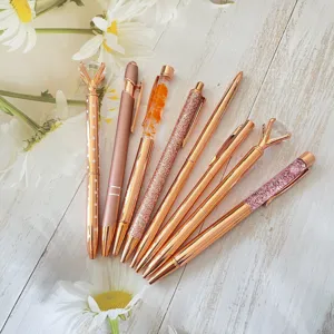 Set of 8 rose gold ballpoint pens with rhinestones, glitter and flowers for office use.