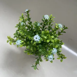 Artificial small potted plant with green leaves and blue flowers for home farmhouse decor.