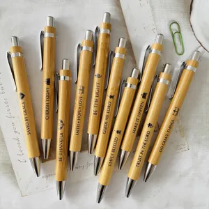 Set of 10 bamboo ballpoint pens featuring inspirational Bible verses and engraved quotes.