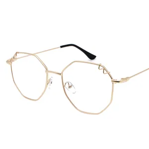 Lunettes à monture métallique dorée surdimensionnées avec design polygonal pour hommes et femmes