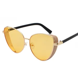 Fashionable women's cat-eye sunglasses with yellow lenses and glittery metal frames