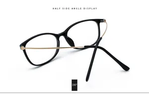 Detailed side view of vintage black glasses frame with elegant golden metal temples