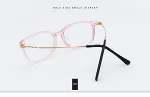 Detailed side view of vintage pink glasses frame with gold metal temples