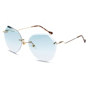 Rimless oversized polygon sunglasses with gradient blue lenses and gold metal temples