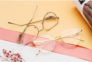 Close-up of retro glasses frames with unique gold and silver wing-shaped decorations