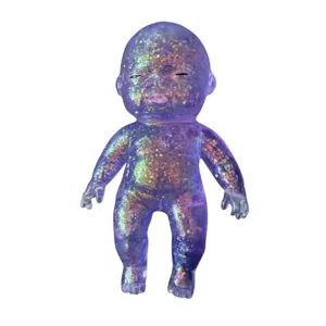 Glitter purple squishy slow rebound stress relief baby doll sensory toy for fun and relaxation.