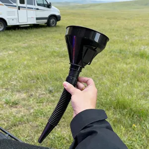 Flexible black plastic car oil funnel detail shot, long retractable tube for easy fueling.