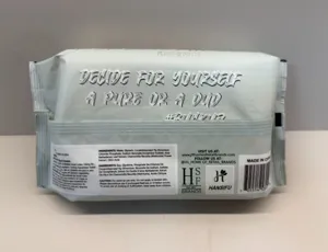 Wet wipe packaging detail showing product ingredients list, brand logo, and slogan.