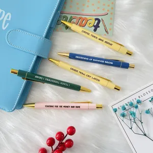 Teacher ballpoint pen set detail showing multi-color metallic pens with funny text quotes.