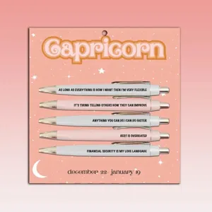 Close-up detail of the Capricorn themed ballpoint pen set, featuring fun quotes and pink card.
