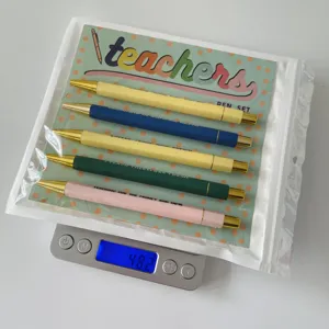 Detailed view of the 5-piece teacher ballpoint pen set with colorful quotes on card, gift.