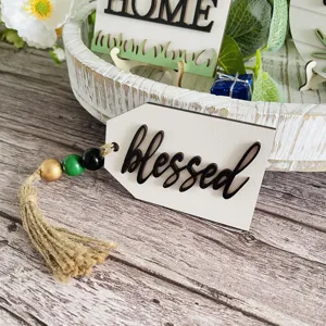 Farmhouse tiered tray decor detail shot showing blessed wooden tag with jute tassel.
