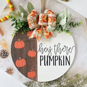 Autumn pumpkin wooden hanging sign detail, rustic fall home decor door plaque with cute bow.