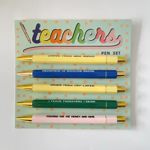 Teacher ballpoint pen set with funny quotes on colorful barrels and backing card display.