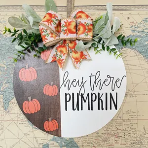 Fall autumn wooden door sign with cute pumpkin pattern and burlap bow, rustic decor.