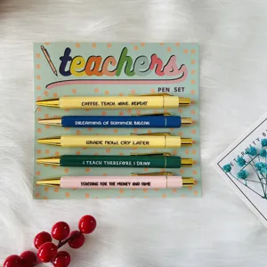Detailed view of 5-piece teacher ballpoint pen set with colorful backing card and funny quotes.