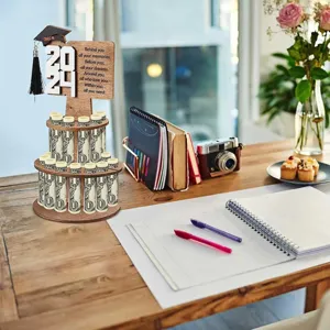 Wooden tiered graduation money holder desk display stand with 2024 sign and inspiring plaque.