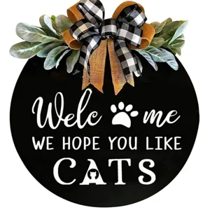 Wooden cat welcome door sign detail, rustic round hanging plaque with buffalo plaid bow.