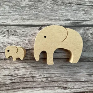 Wooden elephant mother and child figurine set, cute animal home decor gift detail.