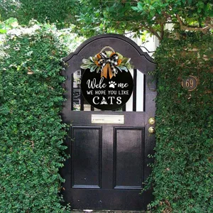 Wooden cat welcome door sign with bow and green leaves, perfect for front door yard decor.