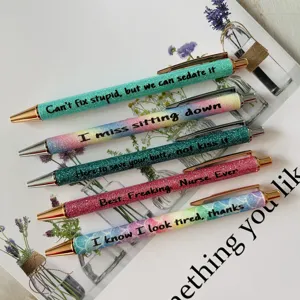 Detailed view of novelty glitter ballpoint pens set with funny nurse quotes, colorful design.