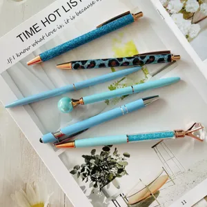 Set of 6 blue ballpoint pens featuring glitter, leopard print, and crystal diamond top designs.