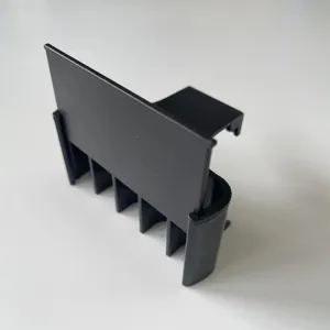 Black plastic aquarium plant holder detail, fish tank hydroponic bracket close up.